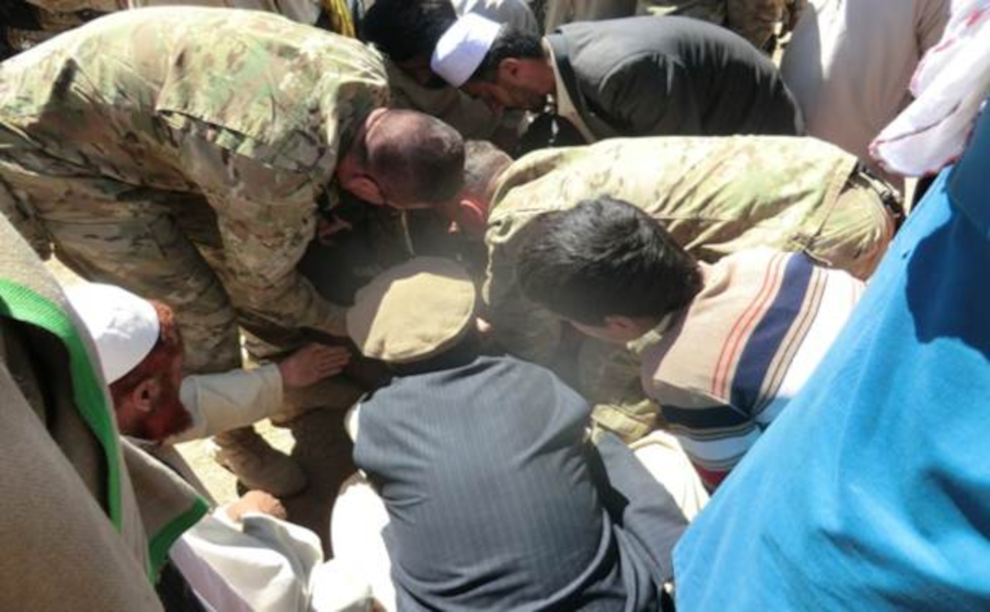 LOGAR PROVINCE, Afghanistan -- Tech. Sgt.  Kody Jorgensen and Staff Sgt. Zachery Williams, both veterinary technicians for livestock animals, teach local Afghans techniques on hoof care, castration and sheering for domestic animals.  The goal of the ADT is to increase agriculture productivity by increasing farmers’ access to inputs and effective services while increasing the Afghans’ confidence in their local government.  (courtesy photo)
