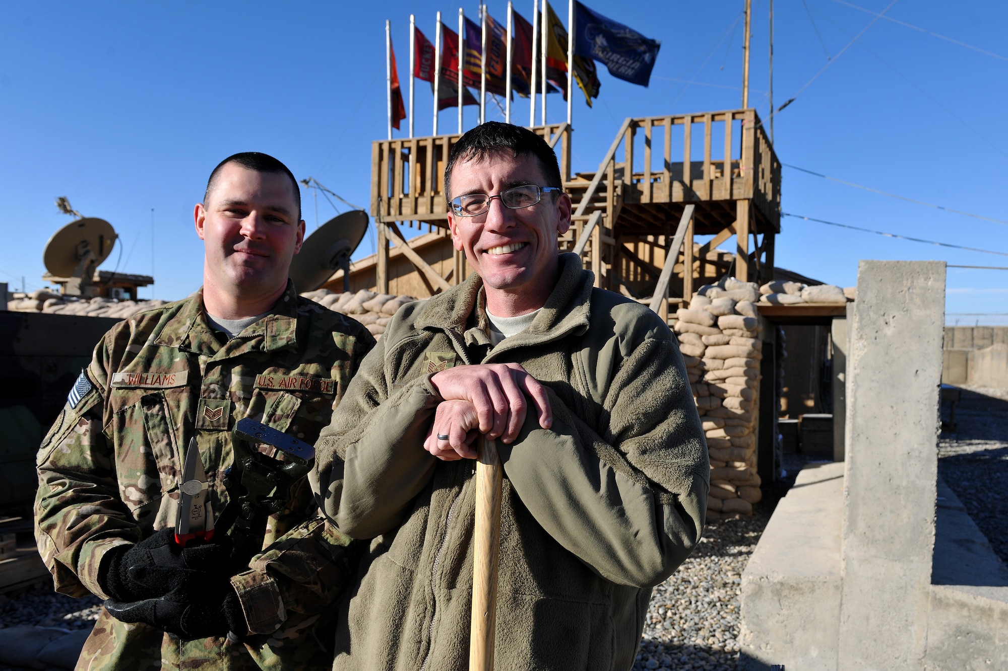 LOGAR PROVINCE, Afghanistan -- Tech. Sgt.  Kody Jorgensen and Staff Sgt. Zachery Williams, both veterinary technicians, stand in front of the Georgia Agriculture Development Team’s headquarters at Forward Operating Base Shank, Jan. 3, 2013.   The goal of the ADT is to increase agriculture productivity by increasing farmers’ access to inputs and effective services while increasing the Afghans’ confidence in their local government.  (U.S. Air Force photo/Senior Airman Chris Willis)