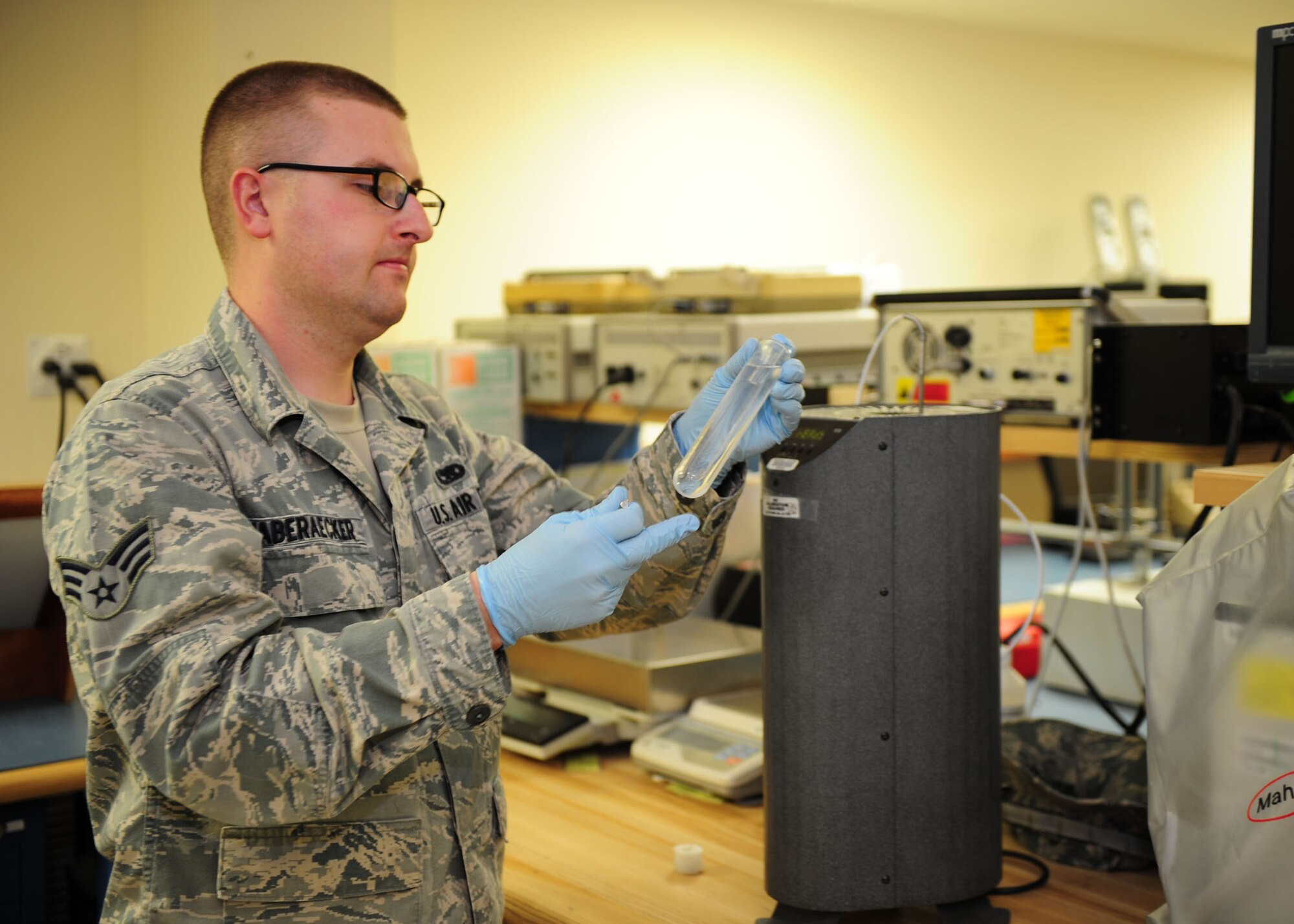 SOUTHWEST ASIA -- Senior Airman Bryan Haberaecker, 379th Expeditionary Maintenance Squadron Test, Measurement and Diagnostic Equipment unit, creates a triple point of water as a point of reference prior to calibrating a piece of equipment. The TMDE unit provides timely and precise calibration of equipment in the area of responsibility. It supports more than 290 work centers and 19 bases in 10 countries throughout the AOR. (U.S. Air Force photo/Master Sgt. Brendan Kavanaugh)