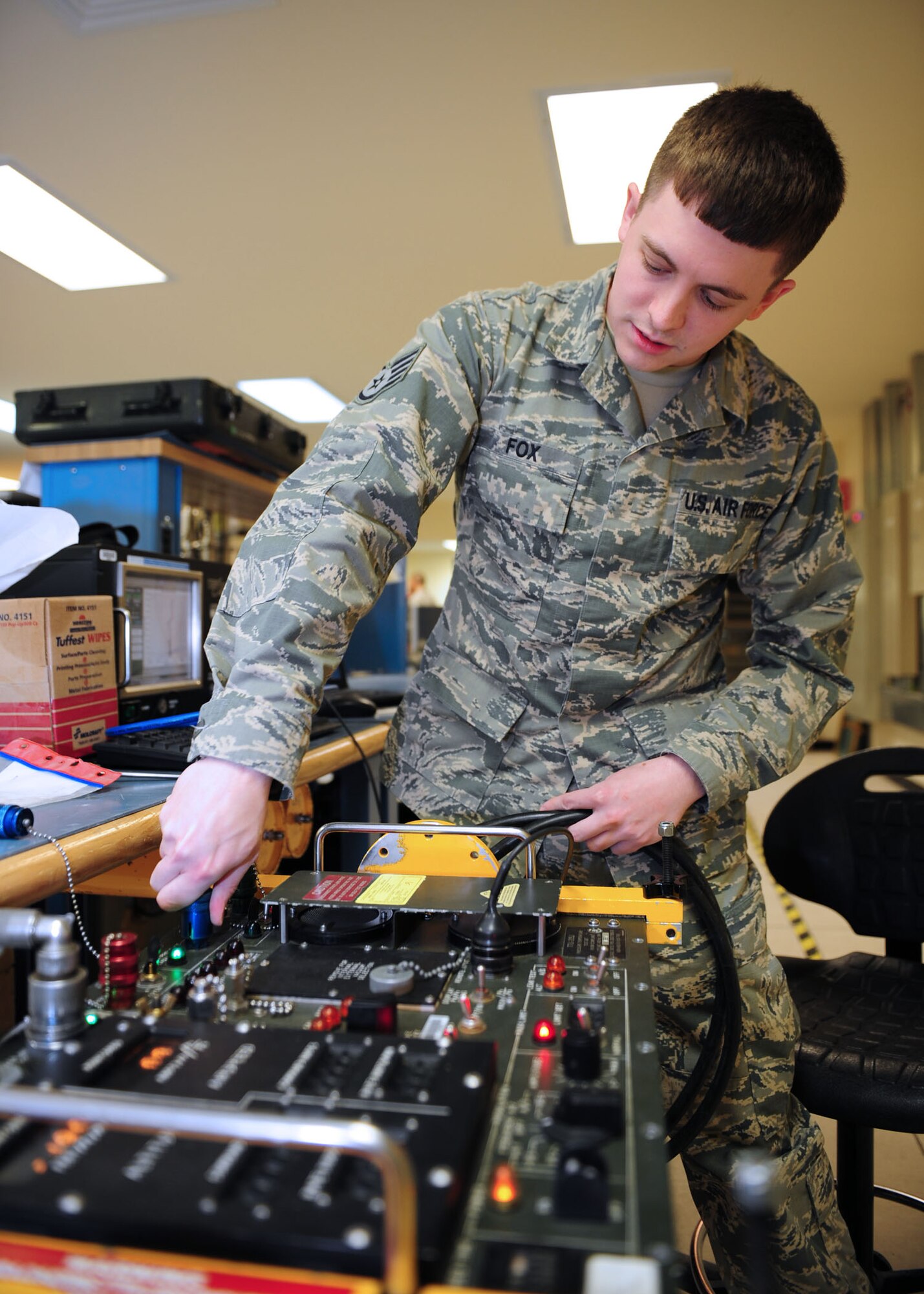 SOUTHWEST ASIA -- Staff Sgt. Ryan Fox, 379th Expeditionary Maintenance Squadron Test, Measurement and Diagnostic Equipment unit, calibrates a pressure/temperature tester, which simulates airspeed and pressure. The TMDE unit provides timely and precise calibration of equipment in the area of responsibility. It supports more than 290 work centers and 19 bases in 10 countries throughout the AOR. (U.S. Air Force photo/Master Sgt. Brendan Kavanaugh)