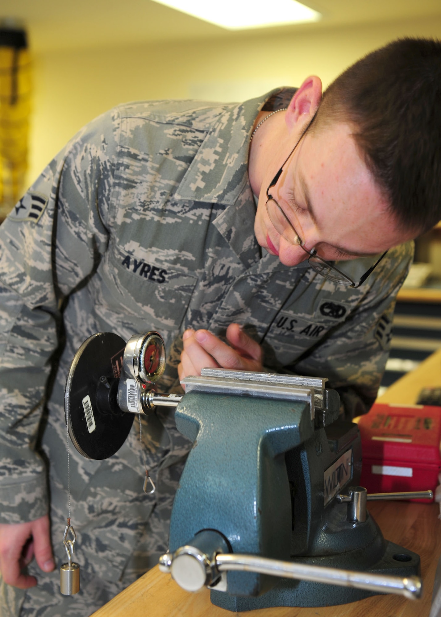 SOUTHWEST ASIA -- Senior Airman Andrew Ayres, 379th Expeditionary Maintenance Squadron Test, Measurement and Diagnostic Equipment unit, calibrates a torque wrench. The TMDE unit provides timely and precise calibration of equipment in the area of responsibility. It supports more than 290 work centers and 19 bases in 10 countries throughout the AOR. (U.S. Air Force photo/Master Sgt. Brendan Kavanaugh)