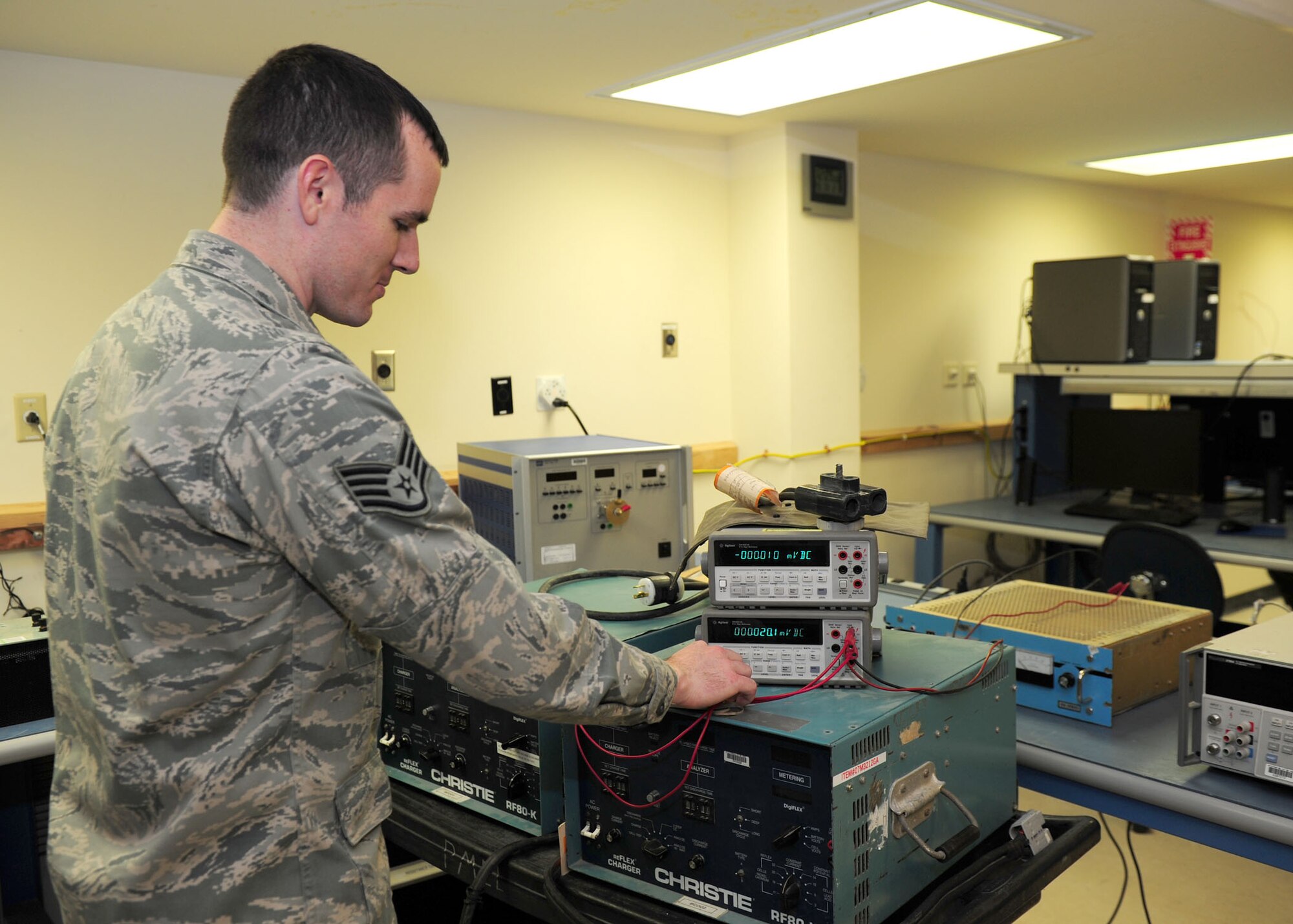 SOUTHWEST ASIA -- Staff Sgt. Joseph Stone, 379th Expeditionary Maintenance Squadron Test, Measurement and Diagnostic Equipment unit, operates a battery reflex charger, which checks the functionality of aircraft batteries. The TMDE unit provides timely and precise calibration of equipment in the area of responsibility. It supports more than 290 work centers and 19 bases in 10 countries throughout the AOR. (U.S. Air Force photo/Master Sgt. Brendan Kavanaugh)
