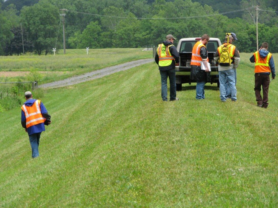 The Baltimore District team of engineers walks the entire 14,000 feet of the Moorefield levee to examine its structural integrity. Anomalies that could require remediation include animal burrows, worn areas, slope failure, evidence of water seepage and vegetation too close to the toe of the levee.