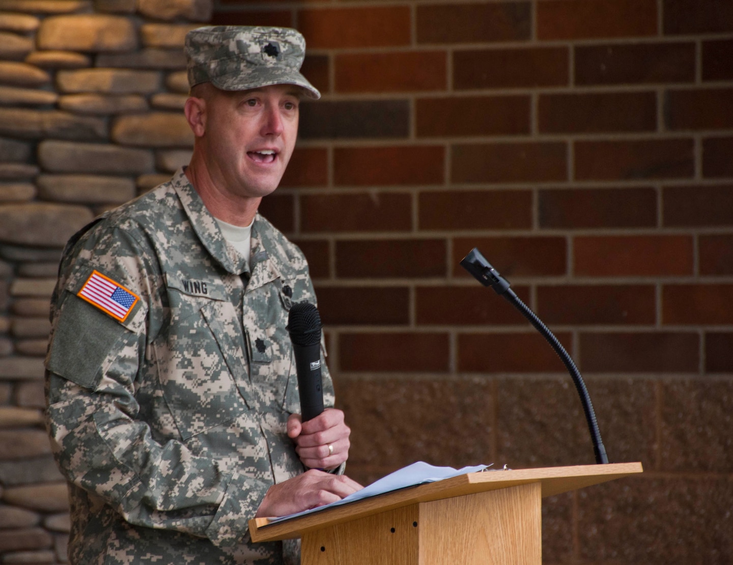 Lt. Col. Jason Wing, Warrior Transition Battallion commander, addresses the crowd of people who attended the Installation Management Command's ribbon cutting ceremony for the Soldier and Family Assistance Center and Open House for the Warrior Transistion Battalion Headquarters held Jan. 7 at Joint Base Lewis McChord.  The building was a U.S. Army Corps of Engineers, Seattle District, military construction project and was built by Doyon Government Group. 