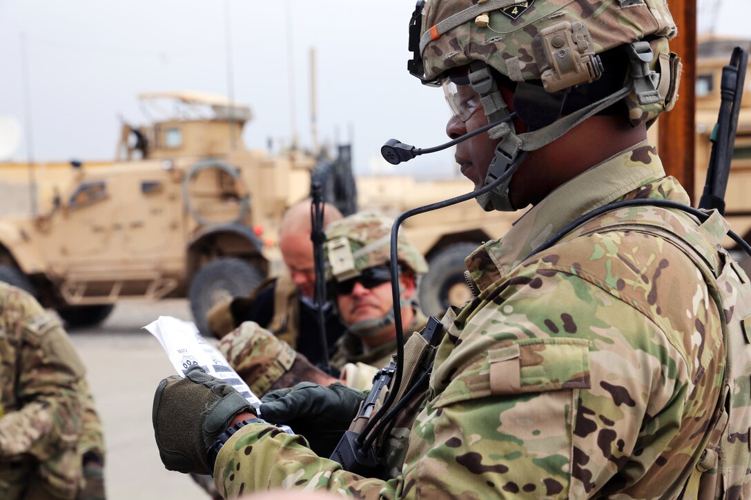 U.s. Army Staff Sgt. Roderick Cooper, Right, Verifies Vehicle 