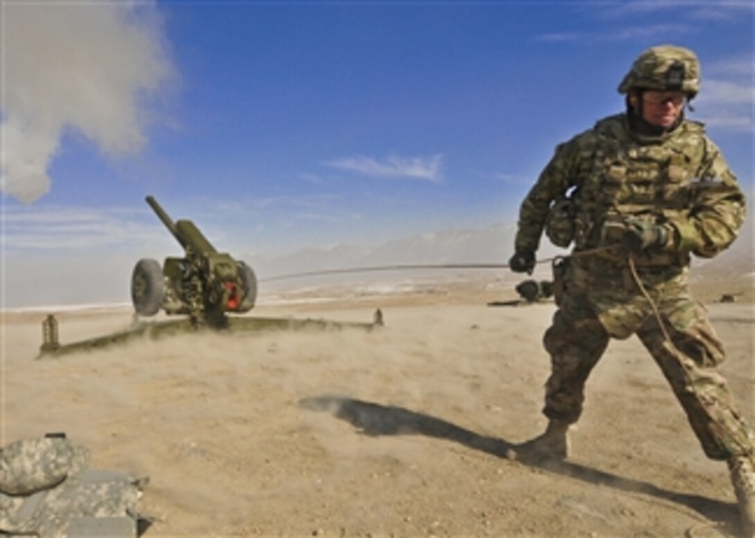 U.S. Army Chief Warrant Officer Michael Lennon pulls the lanyard to fire a D-30 howitzer during a test at the Kabul Military Training Center in Kabul, Afghanistan, on Jan. 6, 2013.  The firing of the howitzer is the last test after being refurbished in Afghanistan.  Lennon is assigned to the NATO Training Mission-Afghanistan at Camp Eggers in Kabul.  