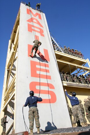 Recruits of Company M, 3rd Recruit Training Battalion, rappel down a tower aboard Marine Corps Recruit Depot San Diego Jan. 4. Recruits wore helmets and gloves for their safety.