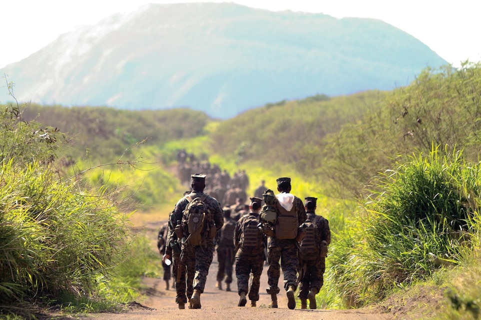 Marines and sailors hike to Mount Suribachi on Iwo To Dec. 19 during a professional military education tour. "I overheard Marines talking about how much they appreciate the opportunity to be here and reflect on the history," said Col. Walter T. Anderson. "For the majority of the Marines, it was their first time coming out here, and we wanted to focus not only on the battle itself, but the logistics of the battle." The Marines and sailors are with 3rd Marine Logistics Group, III Marine Expeditionary Force. The Japanese government reverted the name of the island on which the battle was fought to its pre-World War II name of Iwo To in 2007. Anderson is the assistant chief of staff, G-3, operations and training, 3rd MLG, III MEF.
