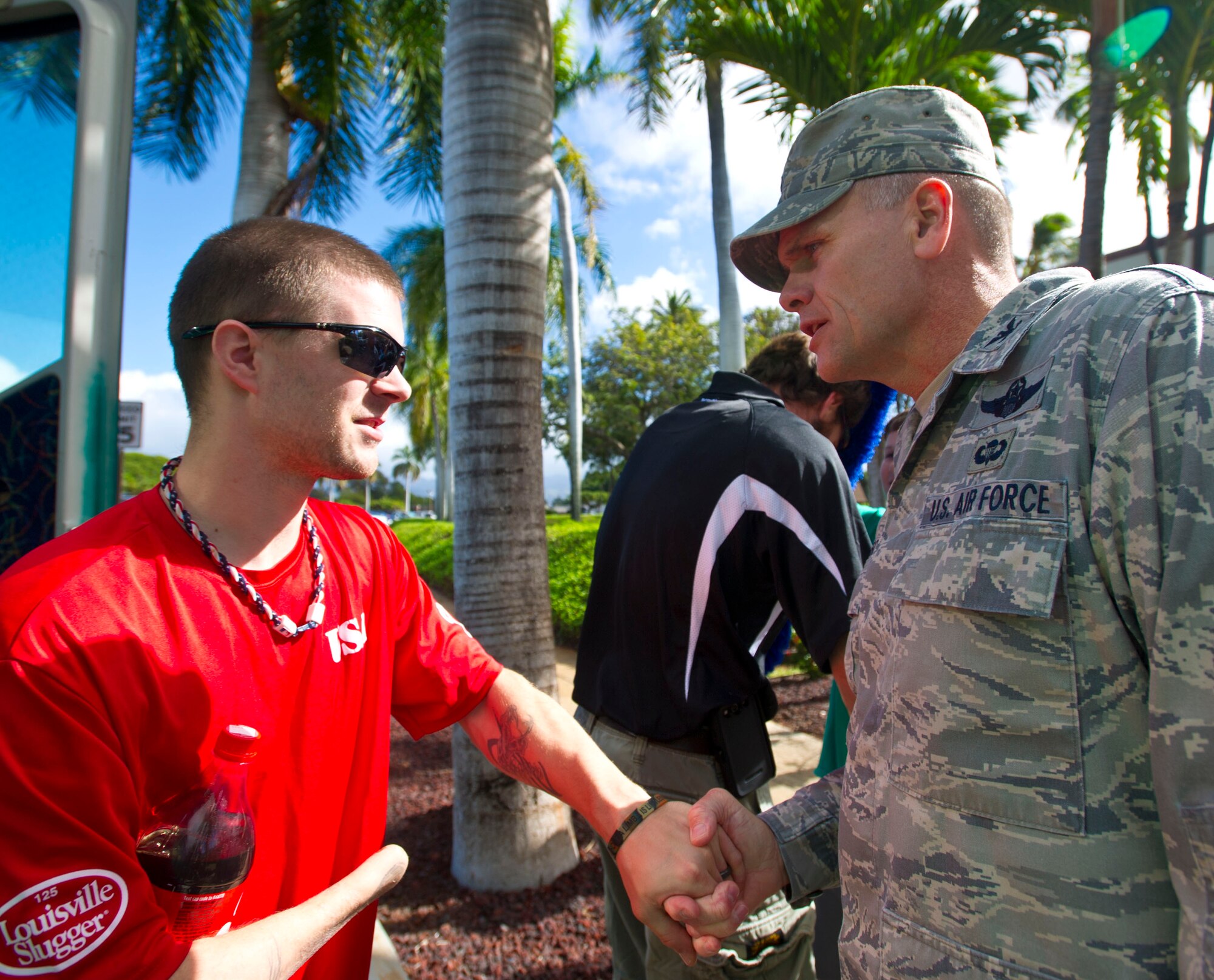 Kyle Earl, a member of the Wounded Warrior Amputee Softball Team, is greeted by Col. Johnny Roscoe, 15th Wing commander, upon arriving at the 15th Wing headquarters building Jan. 10 at Joint Base Pearl Harbor-Hickam, Hawaii. Earl underwent a right hand amputation while serving in the U.S. Marine Corps during Operation Iraqi Freedom. (U.S. Air Force photo by Staff Sgt. Nathan Allen)