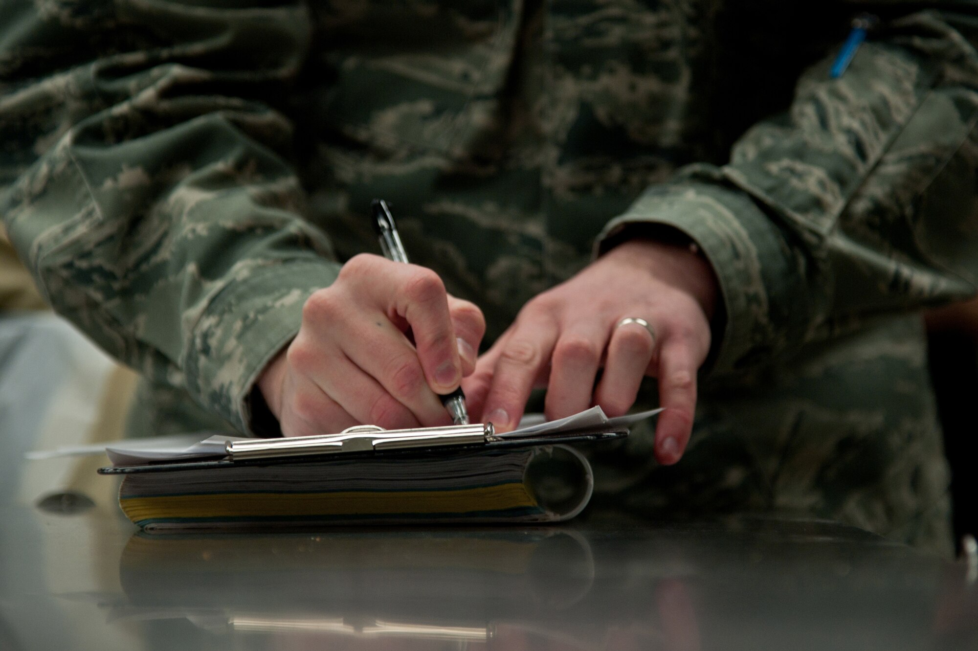 YOKOTA AIR BASE, Japan -- Staff Sgt. Nick Warner, 374th Aerospace Medicine Squadron NCO in charge of food and sanitation element, annotates inspected items at the commissary Jan. 8, 2013, during a food and facility inspection. The food inspectors check food for current expiration dates, food storage temperatures, chlorine levels in cleaning buckets and examine floors for possible insects or signs of rodents. (U.S. Air Force photo by Senior Airman Cody H. Ramirez)