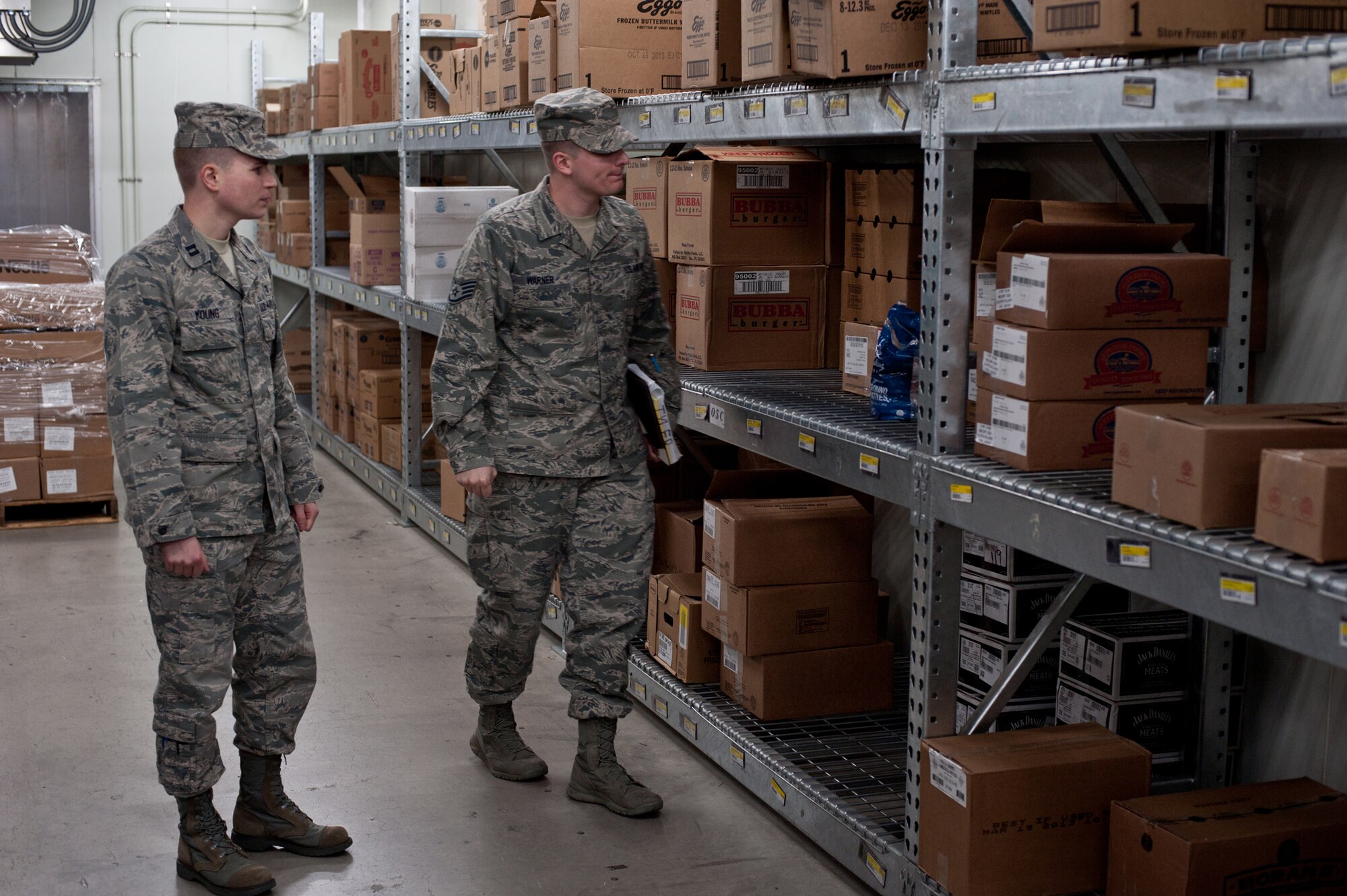 YOKOTA AIR BASE, Japan -- Capt. Kevin Young, Chief of Public Health Operations, and Staff Sgt. Nick Warner, 374th Aerospace Medicine Squadron NCO in charge of food and sanitation element, check food expiration dates in the Yokota Commissary Jan. 8, 2013. Public Health inspects food and base facilities monthly to ensure the community remains healthy and free of possible disease outbreaks. (U.S. Air Force photo by Senior Airman Cody H. Ramirez)