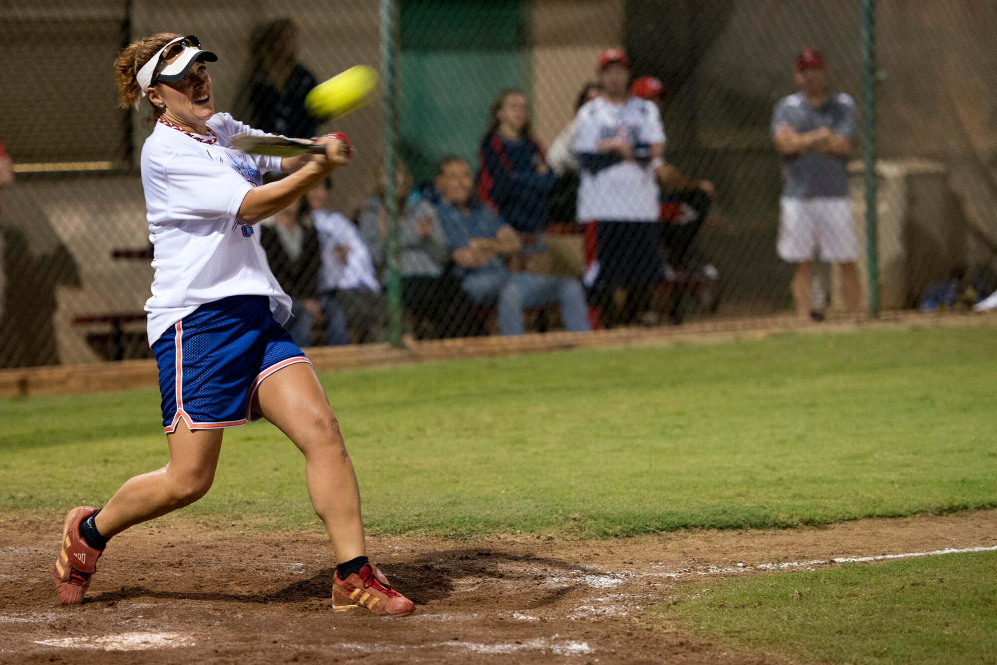 Karen Reed, Hickam Chiefs Group, makes connection with a pitch during action against the Wounded Warrior Amputee Softball Team Jan. 8, 2013, at Milican Field, Joint Base Pearl Harbor-Hickam, Hawaii. Reed is a chief master sergeant and the senior enlisted advisor for the 647th Air Base Group. The Warriors beat the Chiefs 22-17. The WWAST is comprised of competitive, athletic veterans and active duty servicemembers who have lost limbs during post-9/11 combat operations. The team includes individuals with a variety of amputations of the arm, above knee, below knee, bilateral below knee, and foot. Some are still in the service, while others are attending college thanks to the Post-9/11 GI Bill while others have moved on to new careers. (U.S. Air Force photo/Staff Sgt. Mike Meares)