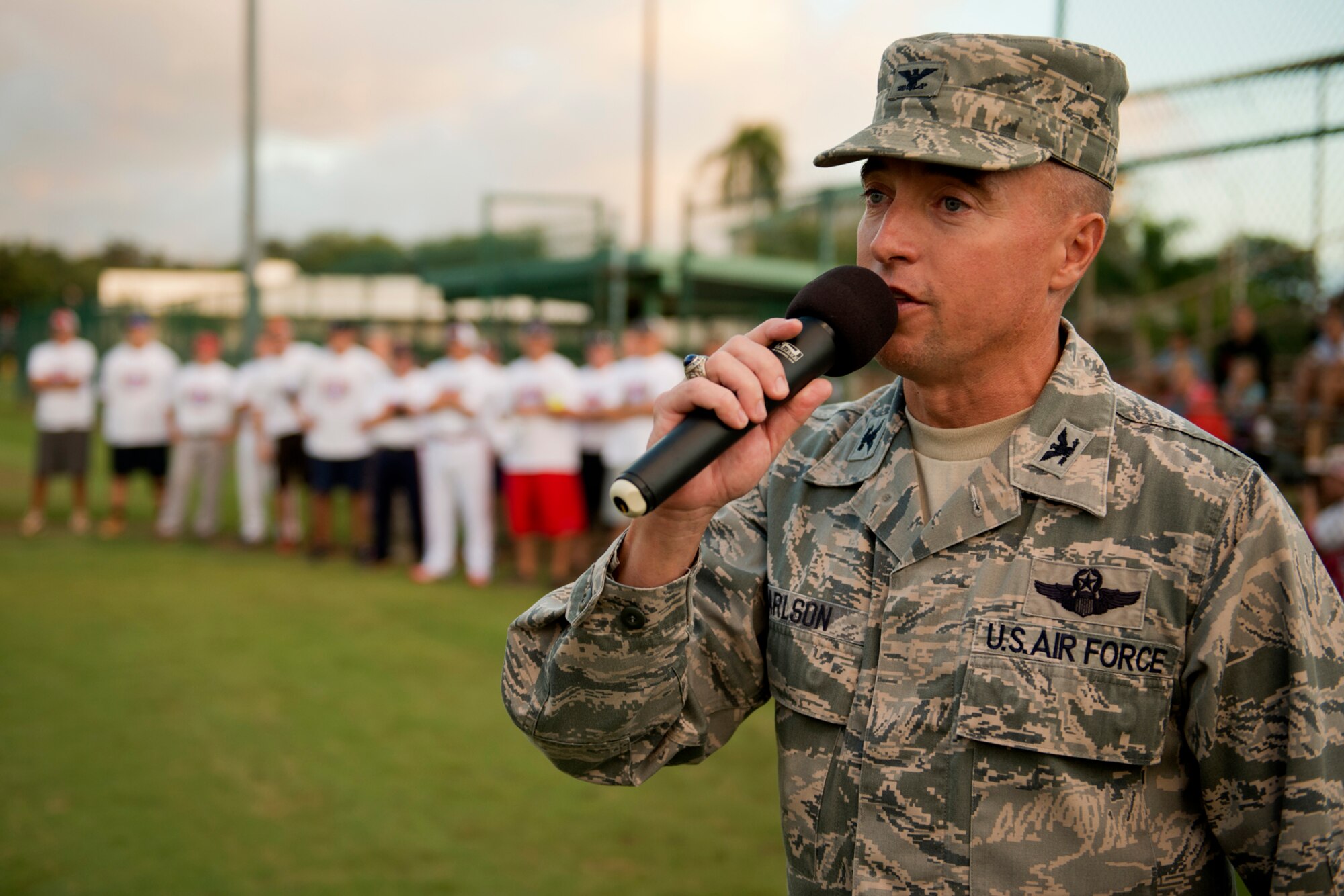 Col. Dann Carlson, 647th Air Base Group commander and Joint Base Pearl Harbor-Hickam deputy commander, welcomes members of the Wounded Warrior Amputee Softball Team before the first of a double header against two Hickam Field teams, Hickam Force and Hickam Chiefs, Jan, 8, 2013, at Milican Field, JBPHH, Hawaii. The WWAST is comprised of competitive, athletic veterans and active duty servicemembers who have lost limbs during post-9/11 combat operations. The team includes individuals with a variety of amputations of the arm, above knee, below knee, bilateral below knee, and foot. Some are still in the service, while others are attending college thanks to the Post-9/11 GI Bill while others have moved on to new careers. (U.S. Air Force photo/Staff Sgt. Mike Meares)