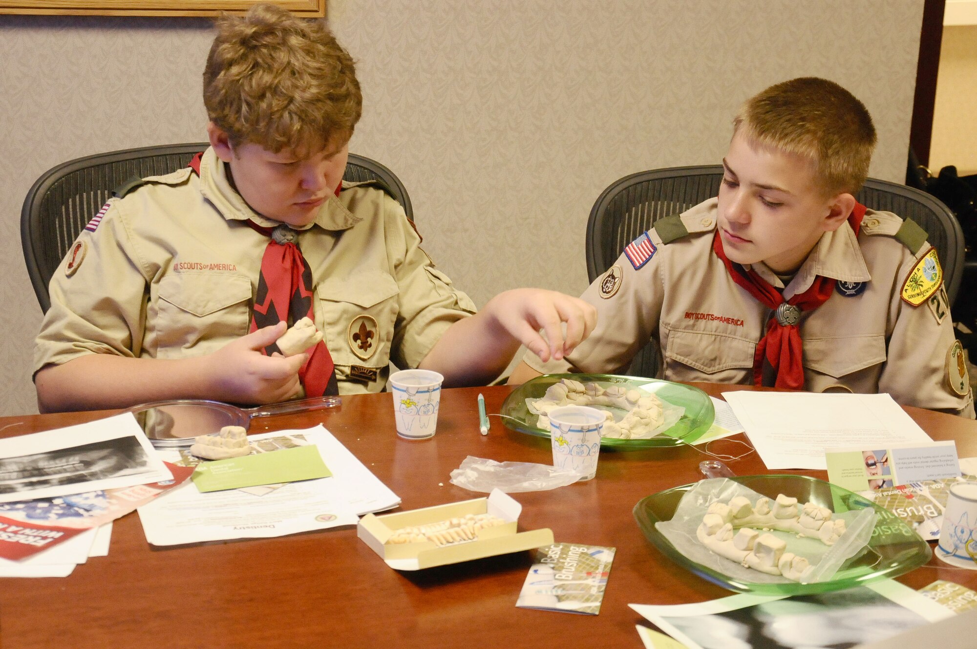 Members of Boy Scouts Troop 20 play with model teeth while learning the importance of dental hygiene during a visit to the dental clinic at Andersen Air Force Base, Guam, Jan. 4. The Boy Scouts attended the presentation to gain awareness and recognize the importance of good dental habits at an early age. February is National Children’s Dental Health Month. (U.S. Air Force photo by Airman 1st Class Mariah Haddenham/Released)