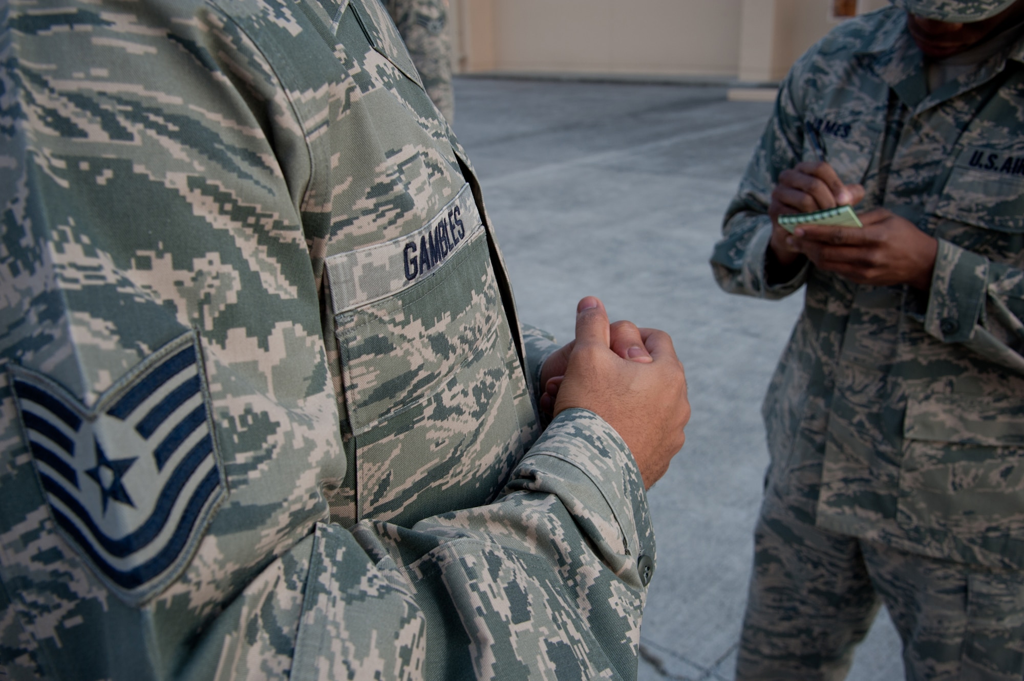 YOKOTA AIR BASE, Japan -- Tech. Sgt. Joseph Gambles, 374th Force Support Squadron Airman Leadership School instructor, teaches a student about drill commands as he takes notes Jan. 9, 2013, during the current ALS class. Students were instructed on the basics of military formations and drill during the class. (U.S. Air Force photo by Senior Airman Cody H. Ramirez)