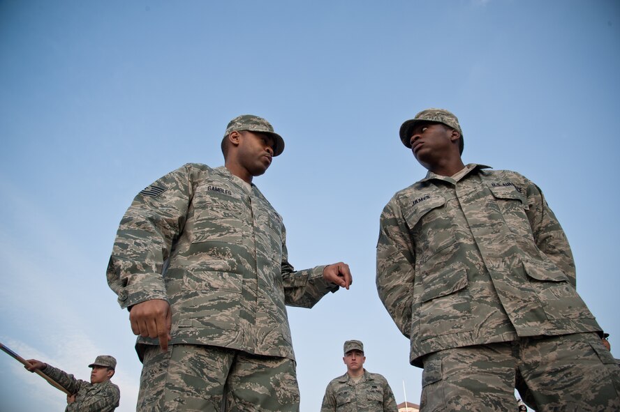 YOKOTA AIR BASE, Japan -- Tech. Sgt. Joseph Gambles, 374th Force Support Squadron Airman Leadership School instructor, discusses drill commands with Staff Sgt. Daniel James, 374th Logistic Readiness Squadron, during a refresher course Jan. 9, 2013, at the Professional Development Center. The Airman Leadership School educates many new NCOs and selectees on their roles as supervisors. (U.S. Air Force photo by Senior Airman Cody H. Ramirez)