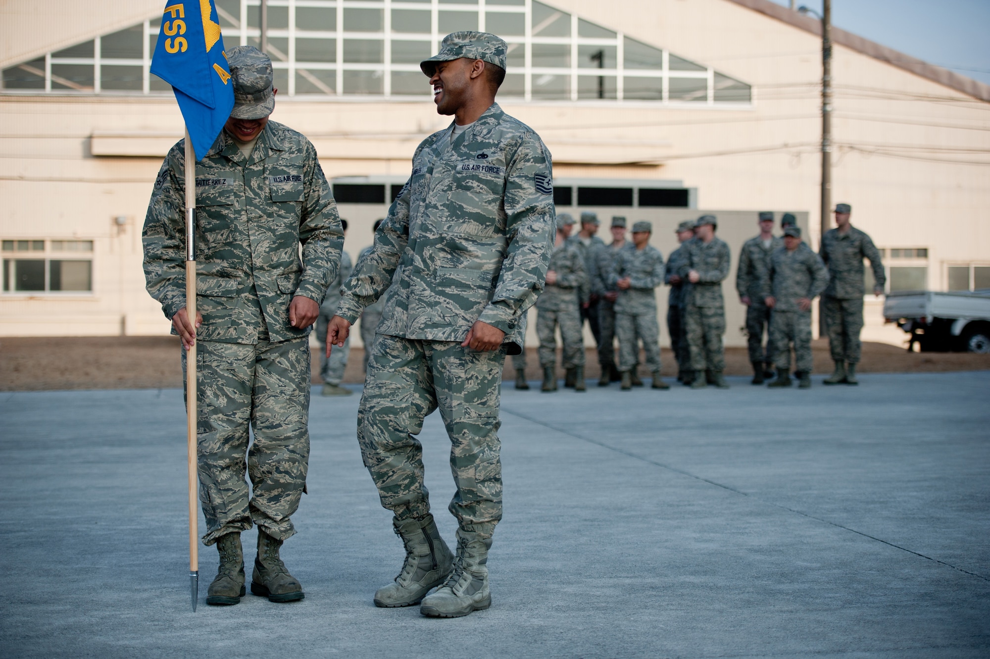 YOKOTA AIR BASE, Japan -- Tech. Sgt. Joseph Gambles, 374th Force Support Squadron Airman Leadership School instructor, enjoys a laugh with a student while teaching basic marching skills to Senior Airman Kevin Gutierrez, 374th Logistical Readiness Squadron, during class Jan. 9, 2013, at the Yokota Professional Development Center.  Airman Leadership School not only prepares students to be effective supervisors and leaders, but also refreshes the individuals on the basics of military drill. (U.S. Air Force photo by Senior Airman Cody H. Ramirez)