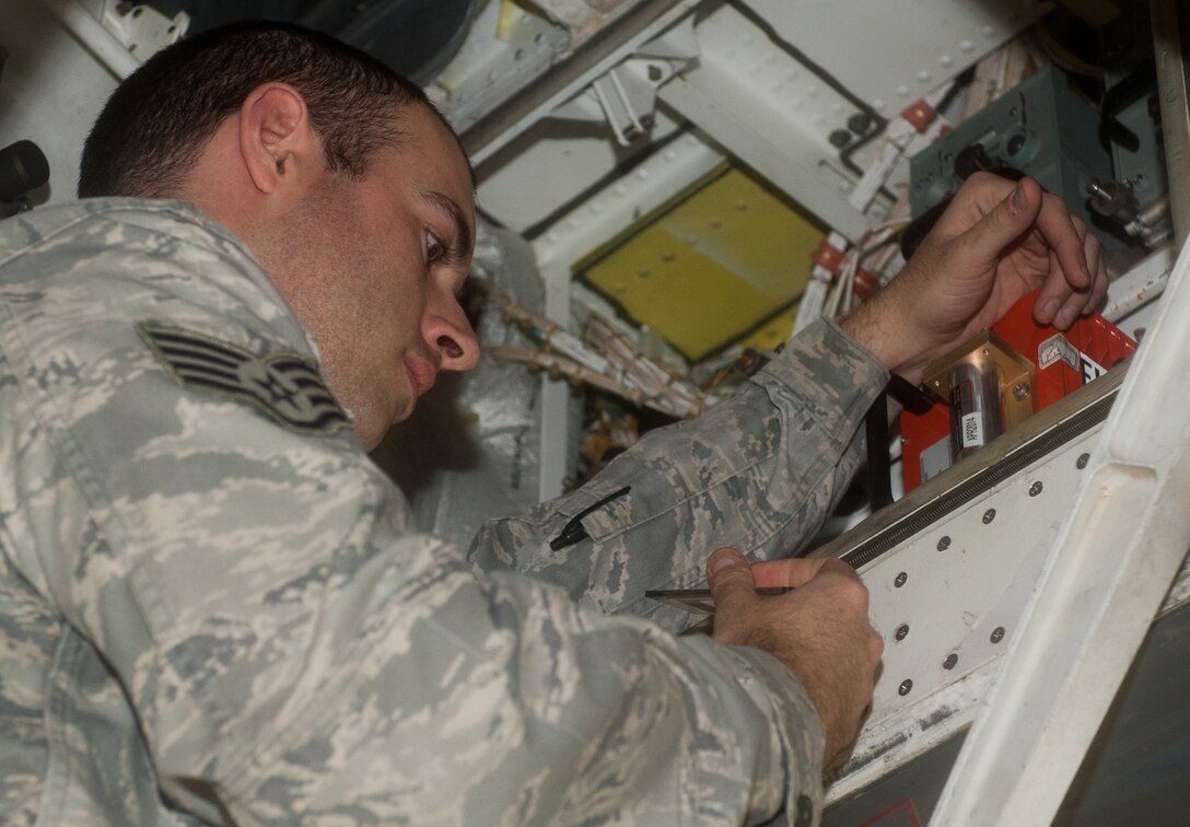 Staff Sgt. Philip Graves, 28th Aircraft Maintenance Squadron instrument flight controls system technician, inspects electrical configurations in a B-1 during scheduled maintenance on Ellsworth Air Force Base, S.D., Jan. 9, 2012. Graves and his fellow instrument flight controls system technicians are responsible for all maintenance of the instruments and flight control electrical systems within the B-1 to ensure proper functionality. (U.S. Air Force photo by Airman 1st Class Kate Thornton-Maurer/Released)