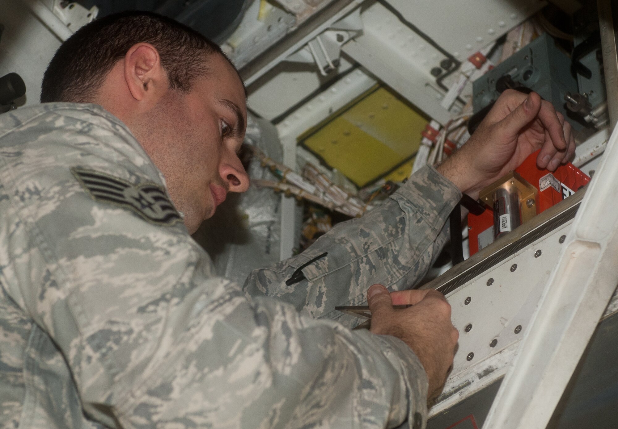 Staff Sgt. Philip Graves, 28th Aircraft Maintenance Squadron instrument flight controls system technician, inspects electrical configurations in a B-1 during scheduled maintenance on Ellsworth Air Force Base, S.D., Jan. 9, 2012. Graves and his fellow instrument flight controls system technicians are responsible for all maintenance of the instruments and flight control electrical systems within the B-1 to ensure proper functionality. (U.S. Air Force photo by Airman 1st Class Kate Thornton-Maurer/Released)