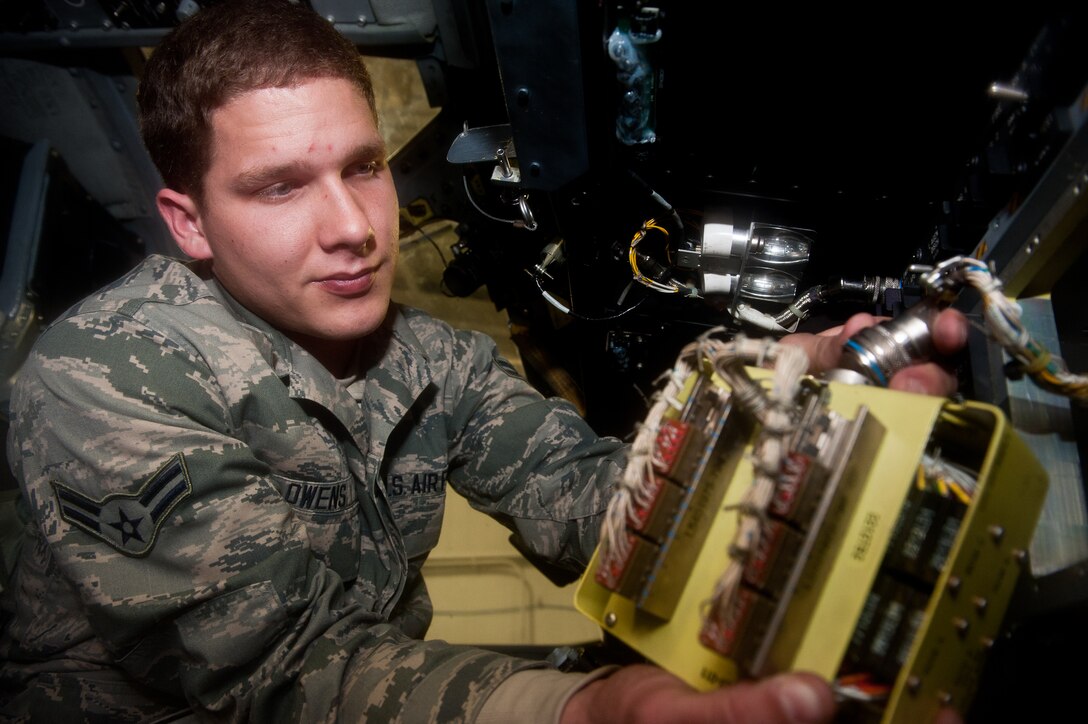 Airman 1st Class Cody Owens, 28th Aircraft Maintenance Squadron instrument flight controls system technician, replaces a lamp driver in the cockpit of a B-1 during scheduled maintenance on Ellsworth Air Force Base, S.D., Jan. 9, 2012. The lamp driver controls all of the cockpit lighting, which is critical for aircrews to clearly see gauges, indicators and other equipment. (U.S. Air Force photo by Airman 1st Class Kate Thornton-Maurer/Released)