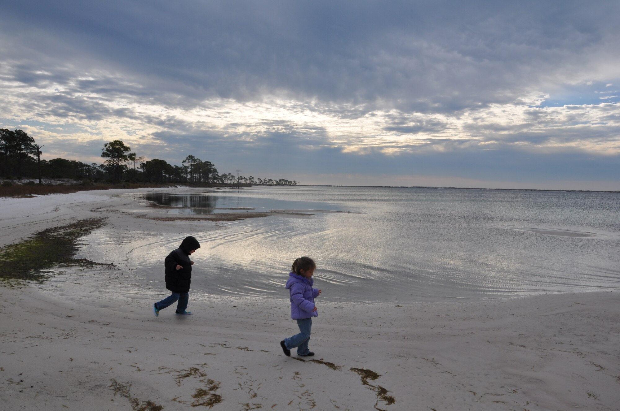 Dalton DeVite shows his sister, Delaney, children of Chief Master Sgt. Raymond DeVite, 325th Fighter Wing command chief, explore the beaches at the end of Pelican Way nature trail. (U.S. Air Force photo by Senior Airman Christopher Reel)