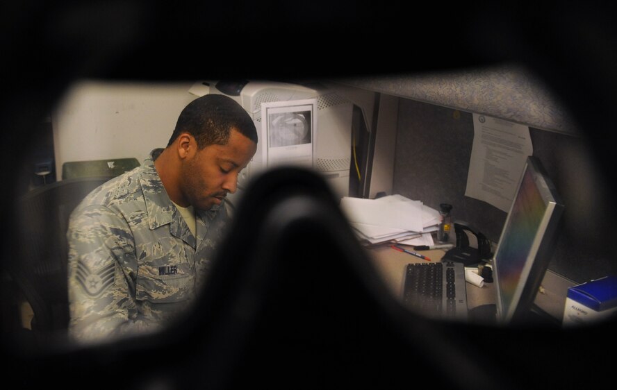 Staff Sgt. Robert D. Miller, 2nd Aerospace Medicine Squadron, records data from a gas mask fit test on Barksdale Air Force Base, La., Jan. 10. Gas mask fit tests, which are held every Thursday from 8 a.m. to 11 a.m. at Bio-Environmental Engineering, ensure Barksdale Airmen have the correctly sized gas mask that can protect them from chemical and biological warfare agents. (U.S. Air Force photo/Airman 1st Class Benjamin Gonsier)
