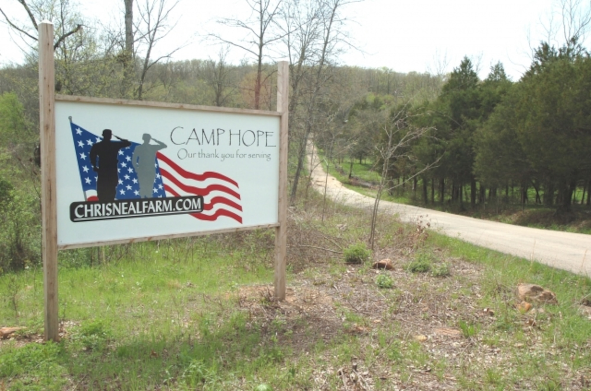 The entrance to Camp Hope, founded by William “Mike” White and his wife, Galia, to honor their fallen son, Marine Pfc. Christopher Neal White, welcomes wounded warriors to the camp’s healing experience. U.S. Army photo by Michael William Petersen
