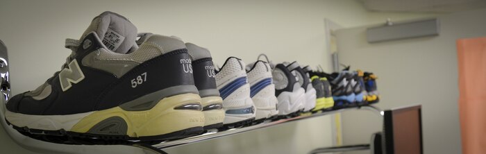 A row of different types of running shoes is displayed at the Gait Analysis Clinic at Joint Base Charleston – Air Base, S.C. The 628th Medical Operations Squadron Physical Therapy section runs the Gait Analysis Clinic to help prevent injuries and improve performance. (U.S. Air Force photo/Staff Sgt. Anthony Hyatt)