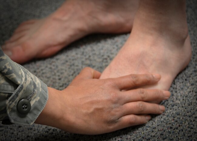 A physical therapist performs a gait analysis on a patient at the Gait Analysis Clinic, Jan. 8, 2013 at Joint Base Charleston – Air Base, S.C. The 628th Medical Operations Squadron Physical Therapy section runs the Gait Analysis Clinic to help prevent injuries and improve performance. The clinic is held twice a month, the second and fourth Tuesday of the month, at Room 103 in the Health and Wellness Center. (U.S. Air Force photo/Staff Sgt. Anthony Hyatt)