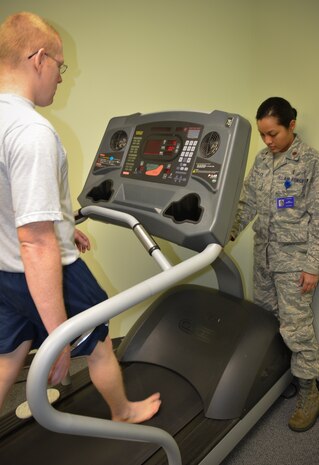 (Right) Maj. Lee Warlick, 628th Medical Operations Squadron Physical Therapy flight commander, observes Staff Sgt. Christopher Hammond, 437th Aircraft Maintenance Squadron crew chief walk bare-foot on a treadmill during an appointment at the Gait Analysis Clinic, Jan. 8, 2013 at Joint Base Charleston – Air Base, S.C. The clinic is held twice a month, the second and fourth Tuesday of the month, at Room 103 in the Health and Wellness Center. (U.S. Air Force photo/Staff Sgt. Anthony Hyatt)