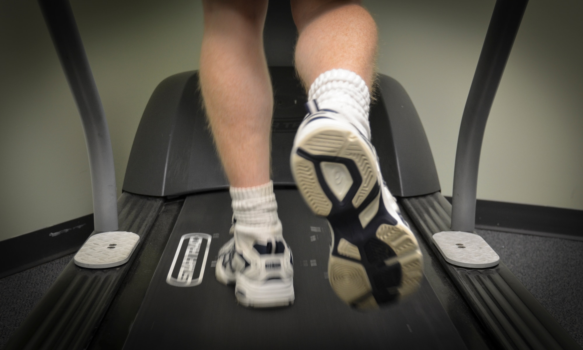 An Airman walks on a treadmill during an appointment at the Gait Analysis Clinic, Jan. 8, 2013 at Joint Base Charleston – Air Base, S.C. During a session with the Gait Analysis Clinic, a physical therapist will observe a patient walk on a treadmill with running shoes and bare-foot. (U.S. Air Force photo/Staff Sgt. Anthony Hyatt)