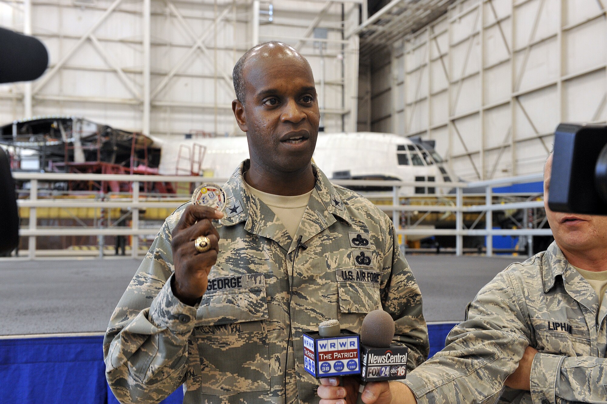 Brig. Gen. Cedric George, Warner Robins Air Logistics Complex commander, speaks to the media following the presentation of the Robert T. Mason Excellence Award Jan. 10 at Robins Air Force Base. The award was presented to the WR-ALC's C-130 Programmed Depot Maintenance team. (U.S. Air Force photo by Tommie Horton)