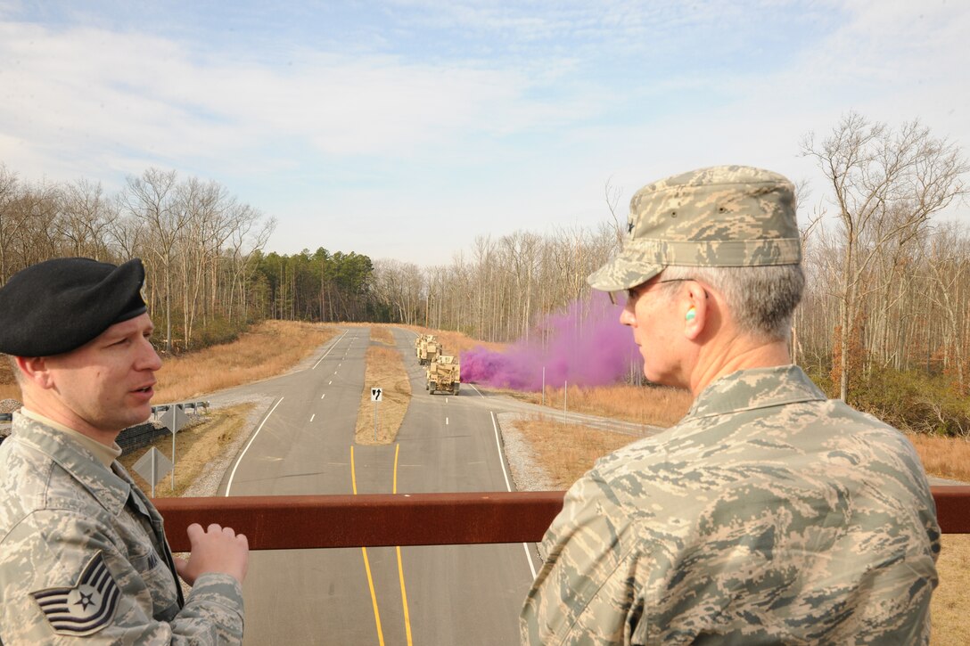 Tech. Sgt. John Mateki, 421st Combat Training Squadron, briefs Gen. Paul Selva, Air Mobility Command commander, about expeditionary combat support training taught at the U.S. Air Force Expeditionary Center during a mounted vehicle demonstration Jan. 9 at Joint Base McGuire-Dix-Lakehurst, N.J. The demonstration featured mounted patrols, counter-improvised explosive device techniques and combat casualty care. (U.S. Air Force photo by Tech. Sgt. Zachary Wilson/Released.)