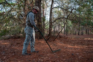 Staff Sgt. Edward Garwick, 628th Civil Engineer Squadron explosive ordnance disposal technician, uses a metal detector to scan for improvised explosives during a routine training exercise Jan. 8, 2013, at Joint Base Charleston - Air Base, S.C. The training prepares EOD members for the tasks involved with finding explosive devices in remote areas during deployments. (U.S. Air Force photo/Airman 1st Class Ashlee Galloway)