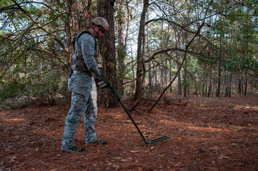 Staff Sgt. Edward Garwick, 628th Civil Engineer Squadron explosive ordnance disposal technician, uses a metal detector to scan for improvised explosives during a routine training exercise Jan. 8, 2013, at Joint Base Charleston - Air Base, S.C. The training prepares EOD members for the tasks involved with finding explosive devices in remote areas during deployments. (U.S. Air Force photo/Airman 1st Class Ashlee Galloway)