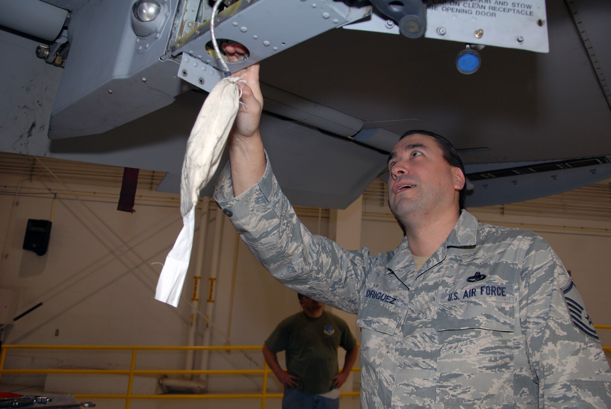 Master Sgt. Victoriano Rodriguez, 23rd Fighter Group, Detachment 2, production supervisor, inspects components on an A-10 Thunderbolt II on Jan. 9, 2013. Rodriguez is part of the total force integration of active-duty Airmen into the Air Force Reserve. The 23rd FG, Detachment 2, is an A-10 Thunderbolt II active-duty unit at Moody Air Force Base, Ga. The detachment operates under the direction of the 442nd Fighter Wing, an A-10 Thunderbolt II Air Force Reserve unit at Whiteman AFB, Mo. (U.S. Air Force photo by Senior Airman Wesley Wright/Released)
