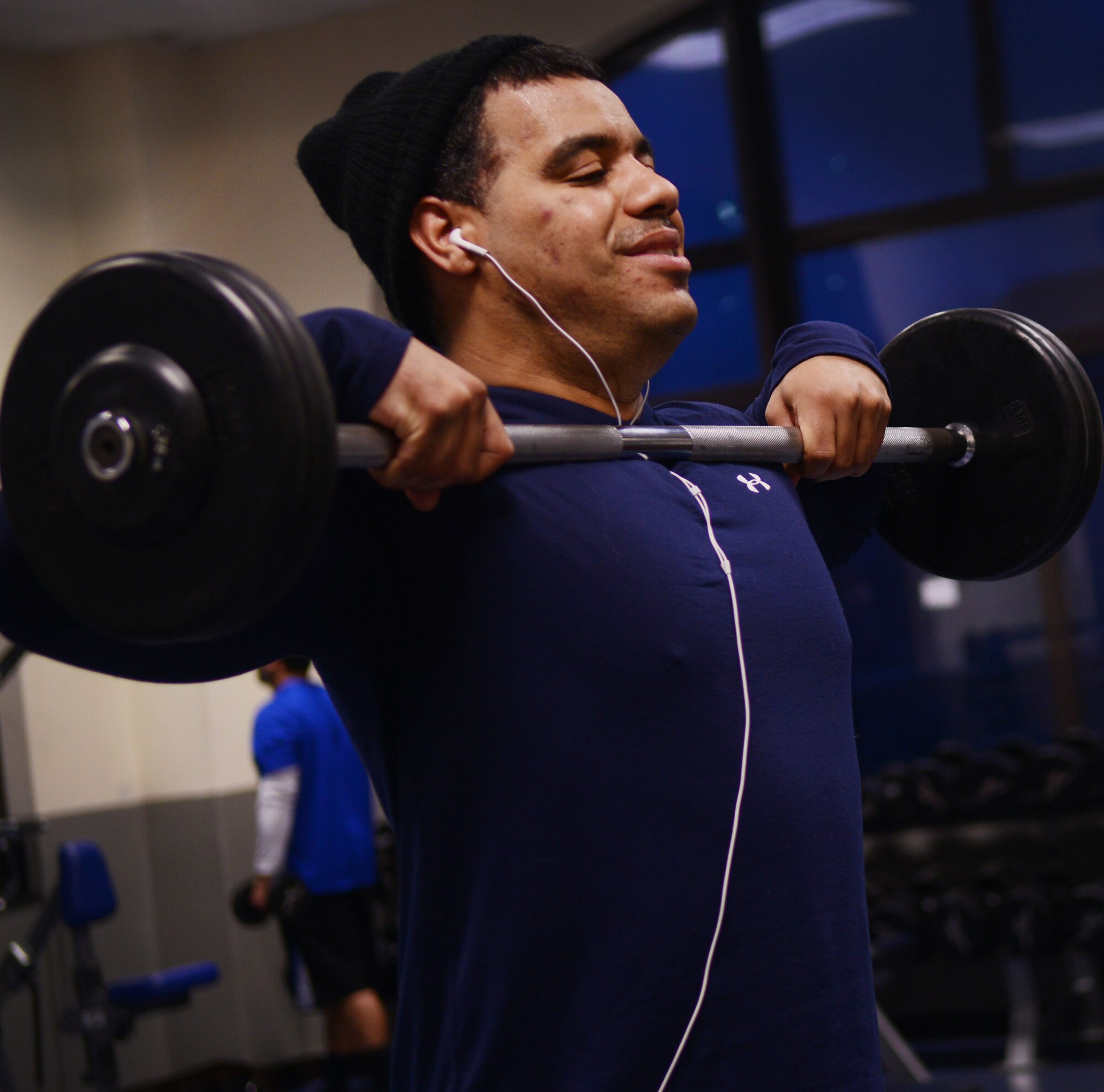 Master Sgt. Manuel Gonzalez, 31st Operations Support Squadron chief controller, lifts weights Jan. 10 at Aviano Air Base, Italy. Weight training, cardio, spin class and all other fitness classes count toward this year’s Biggest Winner competition. (U.S. Air Force photo/Airman 1st Class Briana Jones)