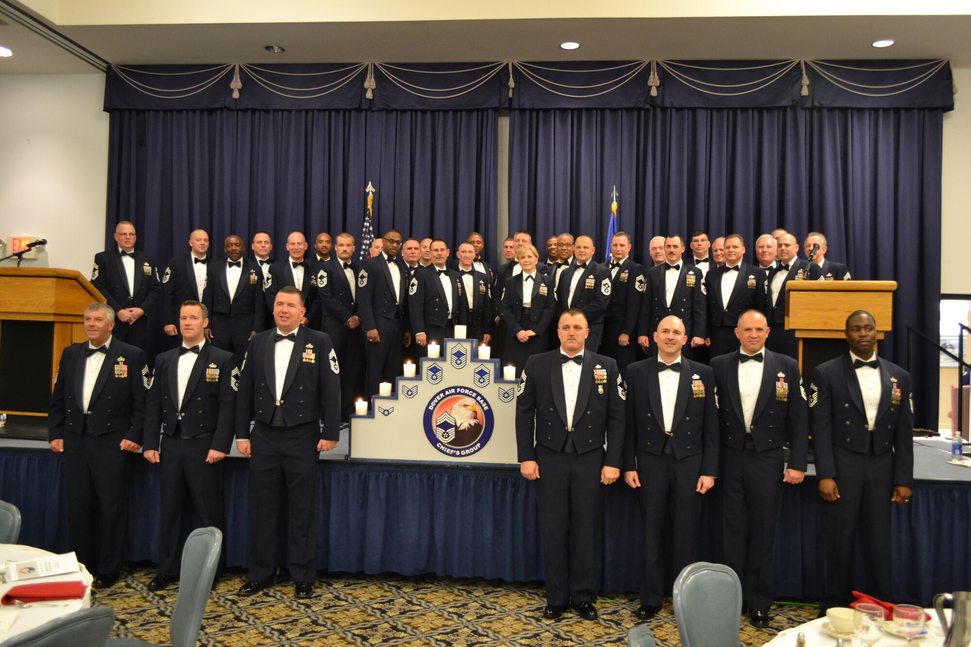Team Dover gathered to recognize the base’s newest chief master sergeants in a banquet Jan. 5, 2013, at The Landings, Dover Air Force Base, Del. The four chiefs from the 512th Airlift Wing were Chief Master Sgt. Brian E. Cullen (front row, fourth from left), 512th Civil Engineer Squadron fire chief, Chief Master Sgt. Scott W. Anderson (front row, second from left), 512th Force Support Squadron superintendent and Chief Master Sgts. William D. Tarrant and Scott W. Nibblett (front row, first and third from left), 512th Aircraft Maintenance Squadron flight chief and aircraft systems manager. (Air Force photo/Tech. Sgt. Tyrone Jordan)