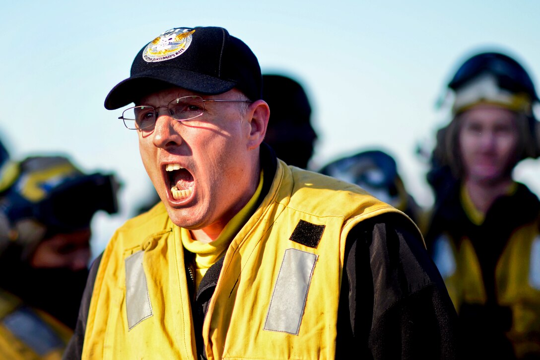 U.S. Navy Lt. Kent Davis gives a briefing aboard the aircraft carrier USS George H.W. Bush under way in the Atlantic Ocean, Jan. 7, 2013. Davis is a flight deck officer. The carrier is conducting training and carrier qualifications. 