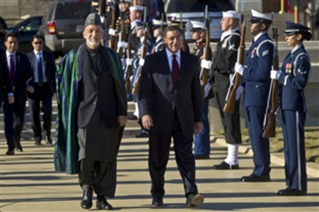 U.S. Defense Secretary Leon E. Panetta hosts an arrival ceremony with full honors to welcome Afghanistan's President Hamid Karzai to the Pentagon, Jan. 10, 2013.