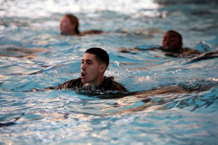 Marines with Combat Logistics Regiment 27, 2nd Marine Logistics Group perform a 25-meter swim assessment during their swim qualification aboard Camp Lejeune, N.C., Jan. 8, 2013. Troops with the regiment did several tests during their qualifications and were grouped into three different classes: basic, intermediate and advanced, depending on their skill levels in the pool. 