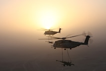 Two U.S. Marine Corps CH-53E Super Stallions with Marine Heavy Helicopter Squadron (HMH) 361, Marine Aircraft Group 16, 3rd Marine Aircraft Wing (Forward), externally lift M777 howitzers over Helmand province, Afghanistan, Dec. 29, 2012. HMH-361 provided aerial support by repositioning the howitzers to Camp Dwyer. (U.S. Marine Corps photo by Sgt. Keonaona C. Paulo/Released)