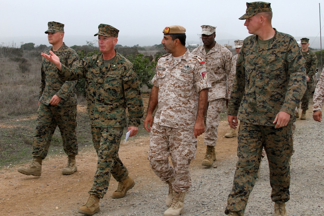 Dec. 20, 2012 Terrance D. Wardinsky, company commander, Field Company, Weapons and Field Training Battalion, walks alongside United Arab Emirate Col. Abdullah Mohammed Saeed Al Dhaheri, commander, Presidential Guard Institute, down a simulated improvised explosive device training event aboard Edson Range, Marine Corps Base Camp Pendleton, Calif., Dec. 5. Senior leaders with the UAE Presidential Guard Institue visited WFTBn during their overview of Marine Corps recruit training to better understand the curriculum. Their plans are to create a similar training cycle for the PGI to create a stronger military. 