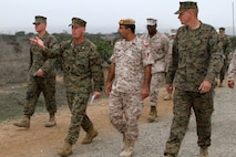 Dec. 20, 2012 Terrance D. Wardinsky, company commander, Field Company, Weapons and Field Training Battalion, walks alongside United Arab Emirate Col. Abdullah Mohammed Saeed Al Dhaheri, commander, Presidential Guard Institute, down a simulated improvised explosive device training event aboard Edson Range, Marine Corps Base Camp Pendleton, Calif., Dec. 5. Senior leaders with the UAE Presidential Guard Institue visited WFTBn during their overview of Marine Corps recruit training to better understand the curriculum. Their plans are to create a similar training cycle for the PGI to create a stronger military. 