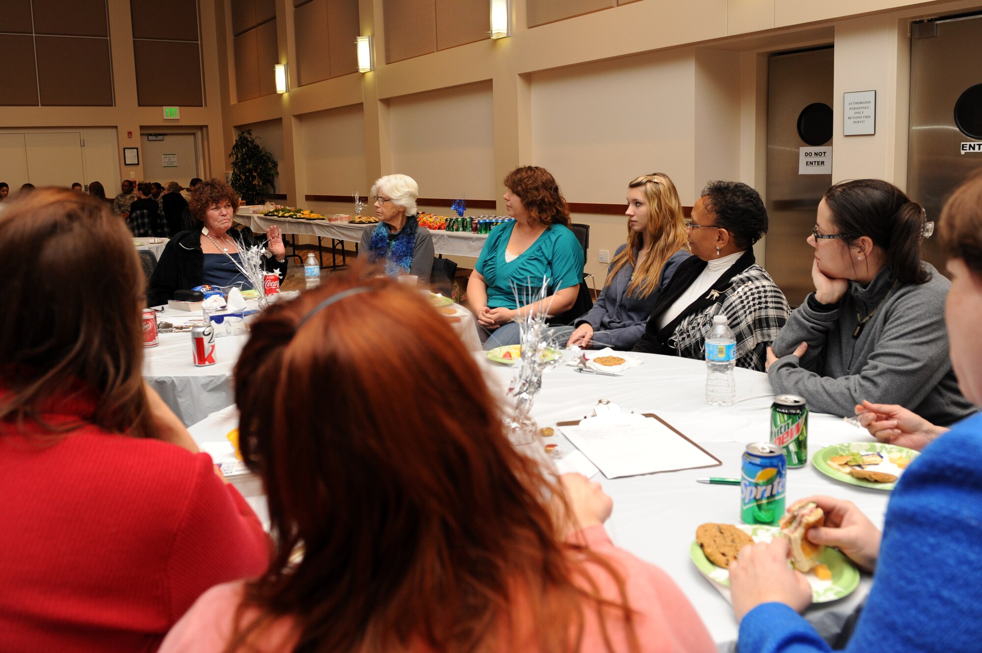 Peggy Moore-McCoy, 460th Space Wing sexual assault response coordinator, third from right, listens to women share their stories Jan. 10, 2013, at Buckley Air Force Base's Leadership Development Center during the Ladies Empowerment Social and Book Club. The book, “The Gift of Fear” by Gavin de Becker, was the topic of the event. (U.S. Air Force photo by Senior Airman Marcy Glass/Released)
