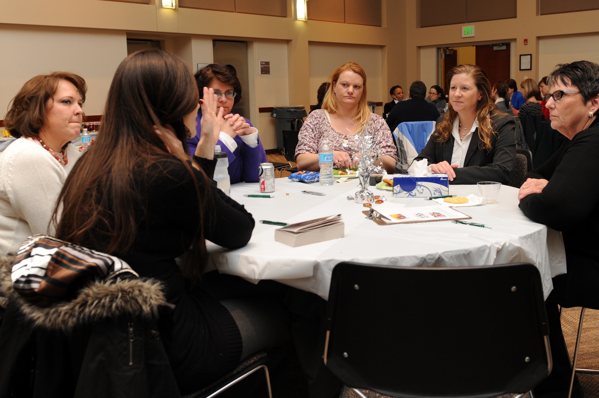 Col. Tracey Hayes, 460th Space Wing vice commander, second from right, converses with attendees of the Ladies Empowerment Social and Book Club Jan. 10, 2013, at Buckley Air Force Base’s Leadership Development Center. Topics at the first gathering of Team Buckley's women included sexual assault, sexual assault prevention and a book called “The Gift of Fear” by Gavin de Becker. (U.S. Air Force photo by Senior Airman Marcy Glass/Released)
