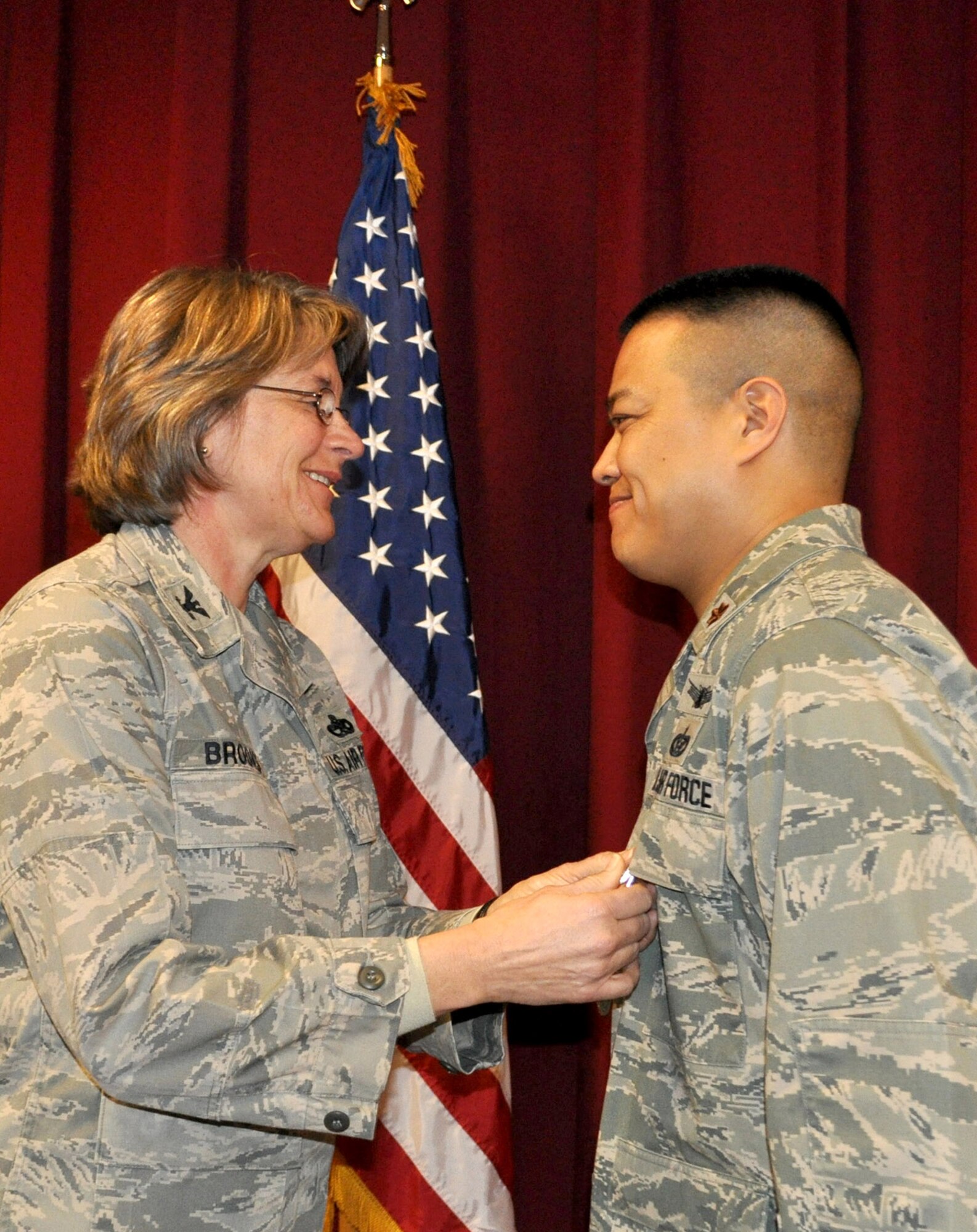 TRAVIS AIR FORCE BASE, Calif. -- Col. Nancy Brooks, 349th Mission Support Group commander, pins the Meritorious Service medal on Maj. Melvin Ibarreta at his Assumption of Command ceremony Jan. 5, 2013. Ibarreta assumed command of the 349th Civil Engineer Squadron, a unit he has been with for 10 years. (U.S. Air Force photo/Senior Master Sgt. Ellen Hatfield)