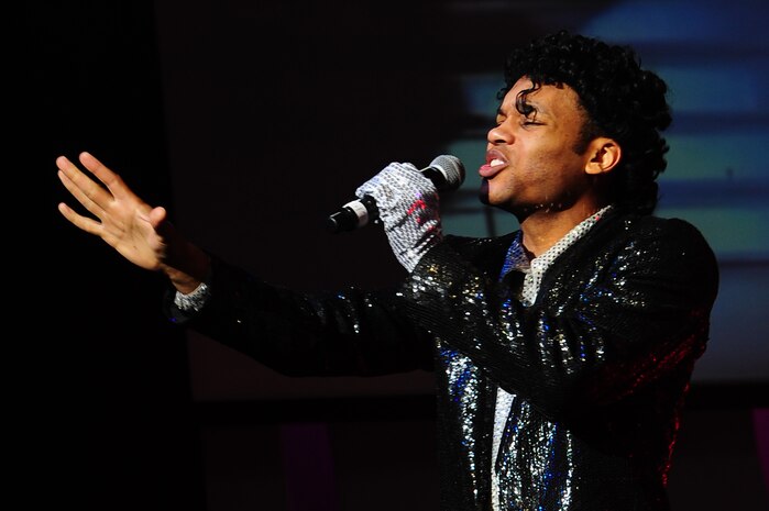 Staff Sgt. Tyron Jones dresses as Michael Jackson as he sings with the Tops in Blue Jan. 9, 2013, at the North Charleston Performing Arts Center, S.C. Composed of vocalists, musicians, dancers and technicians, their primary mission is to perform for military personnel and their families throughout the world. (U.S. Air Force photo/ Airman 1st Class Chacarra Walker)