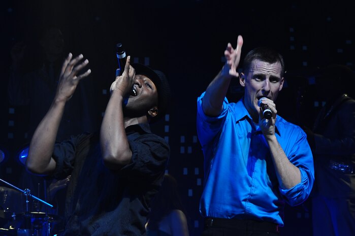 Airman 1st Class Jonathan Leak and 1st Lt. Joseph Mitchell perform during the Tops in Blue concert Jan. 9, 2013, at the North Charleston Performing Arts Center, S.C. Composed of 35 to 40 vocalists, musicians, dancers and technicians, their primary mission is to perform for military personnel and their families throughout the world. (U.S. Air Force photo/ Airman 1st Class Chacarra Walker)