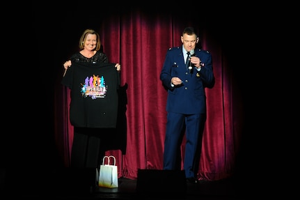 Col. Richard McComb, Joint Base Charleston commander, announces the winners of the T-shirt give-away  before the  Tops in Blue show Jan. 9, 2013, at the North Charleston Performing Arts Center, S.C. Composed of 35 to 40 talented vocalists, musicians, dancers and technicians, their primary mission is to perform for military personnel and their families throughout the world. (U.S. Air Force photo/ Airman 1st Class Chacarra Walker)